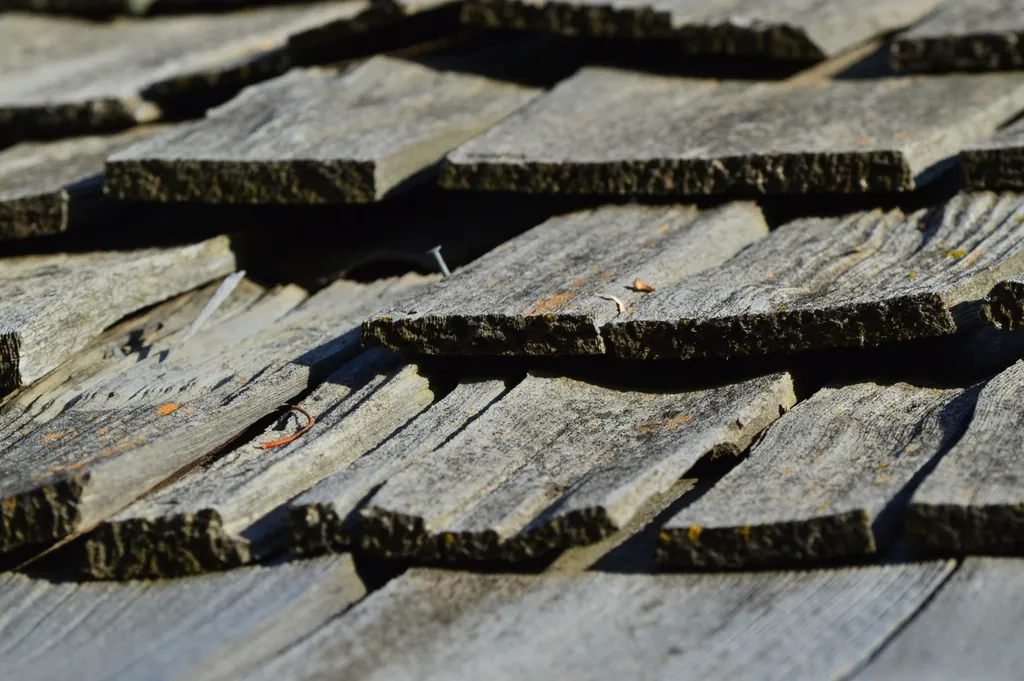Weathered timber roof shingles in close-up